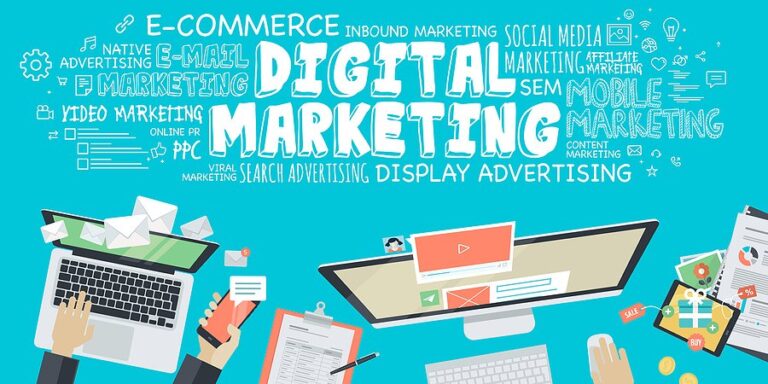 Illustration of the words digital marketing surrounded by laptops and marketing terms